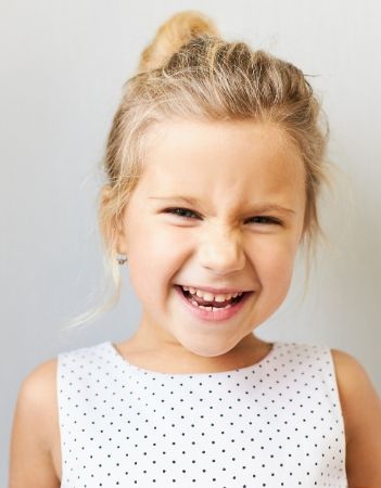 image: Young girl smiling at the camera