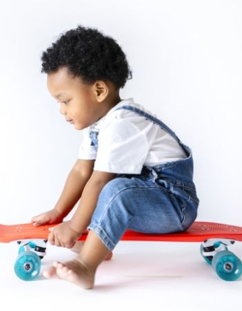 image: young african american boy on skateboard