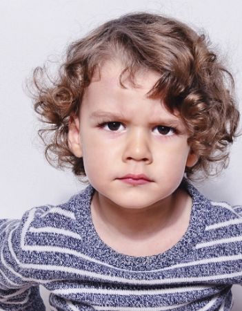 Young boy staring at the camera